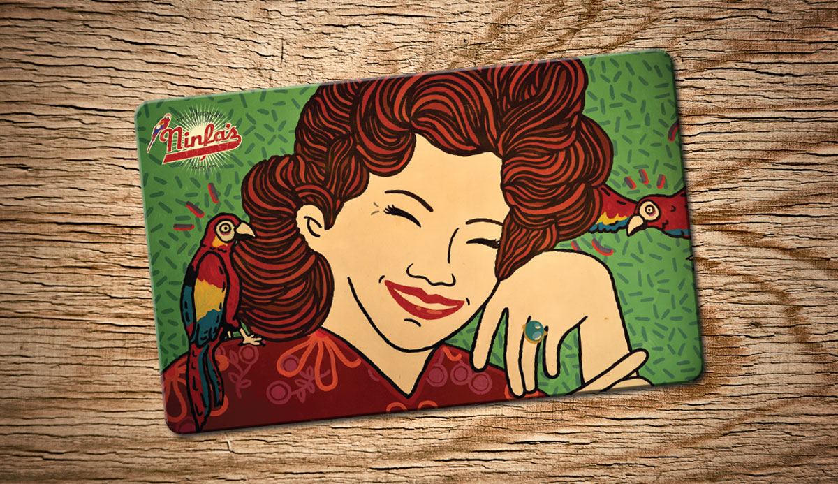 A Ninfa's gift card on a wooden surface.